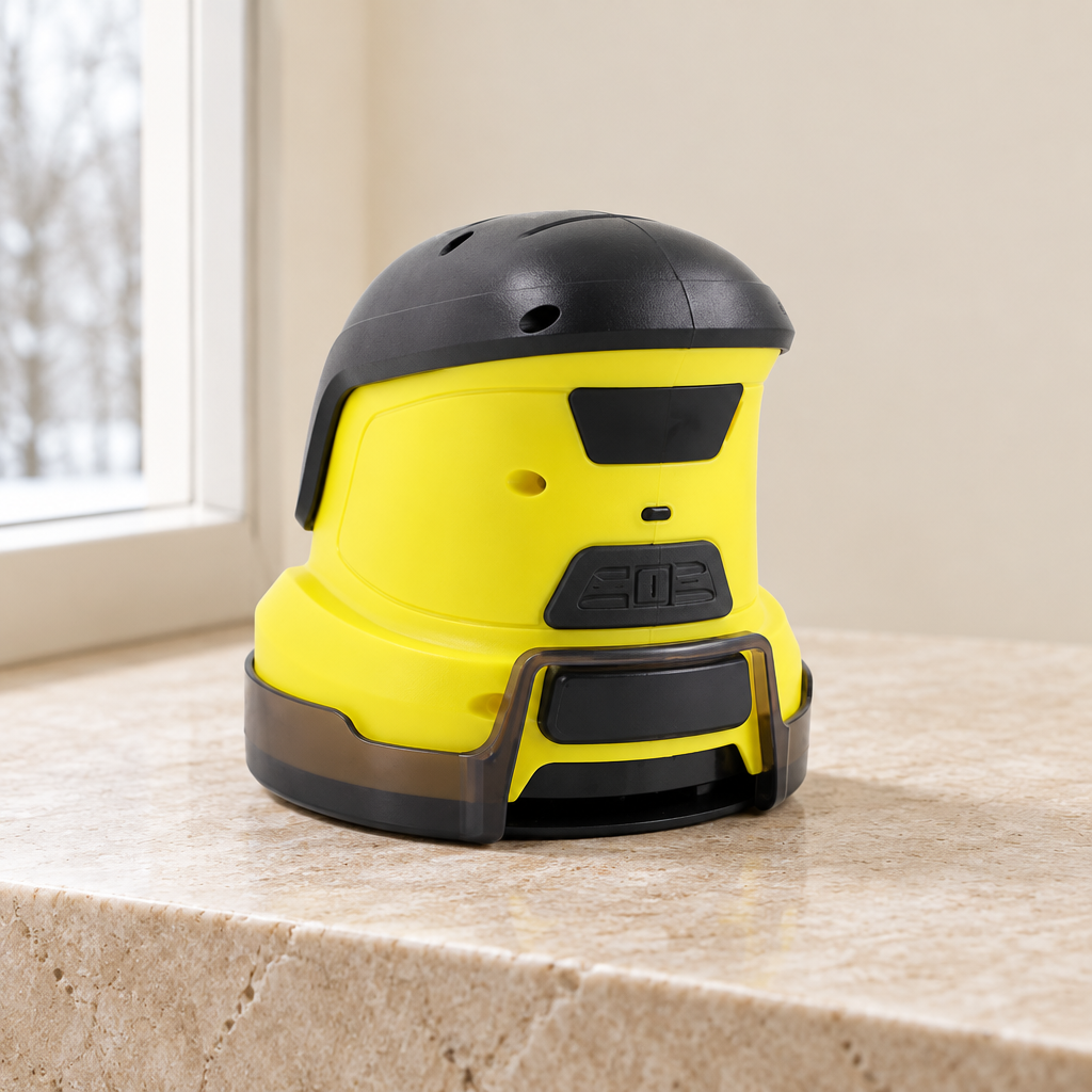 Three-quarter view of yellow and black electric ice scraper